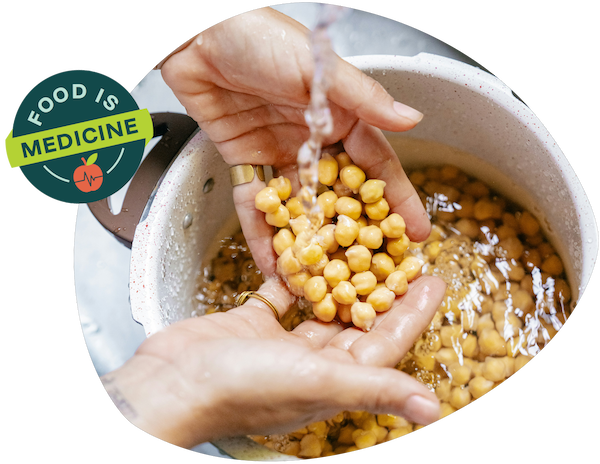 Close-up of hands washing chickpeas