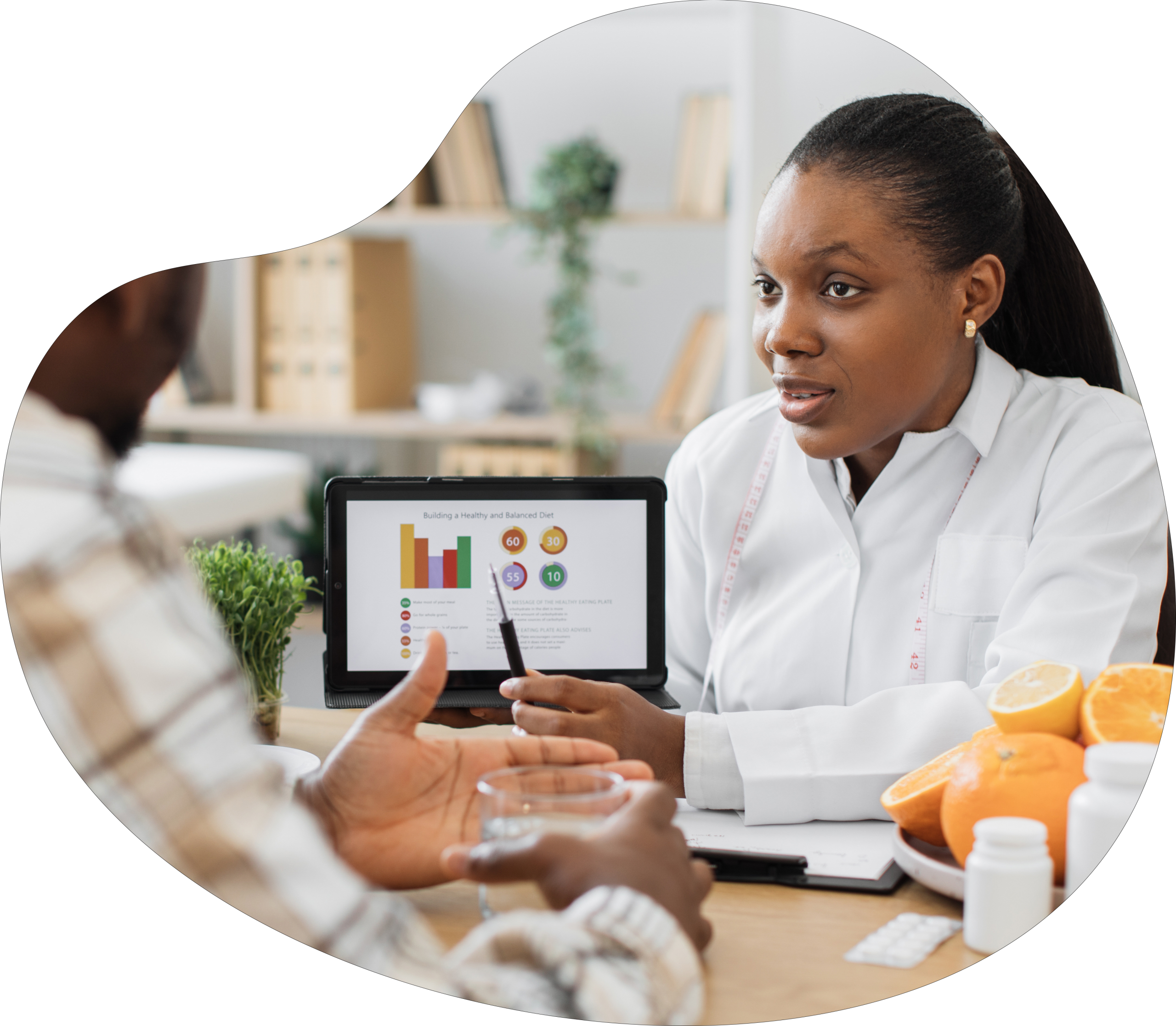 Woman consulting with a man and showing him information on a screen